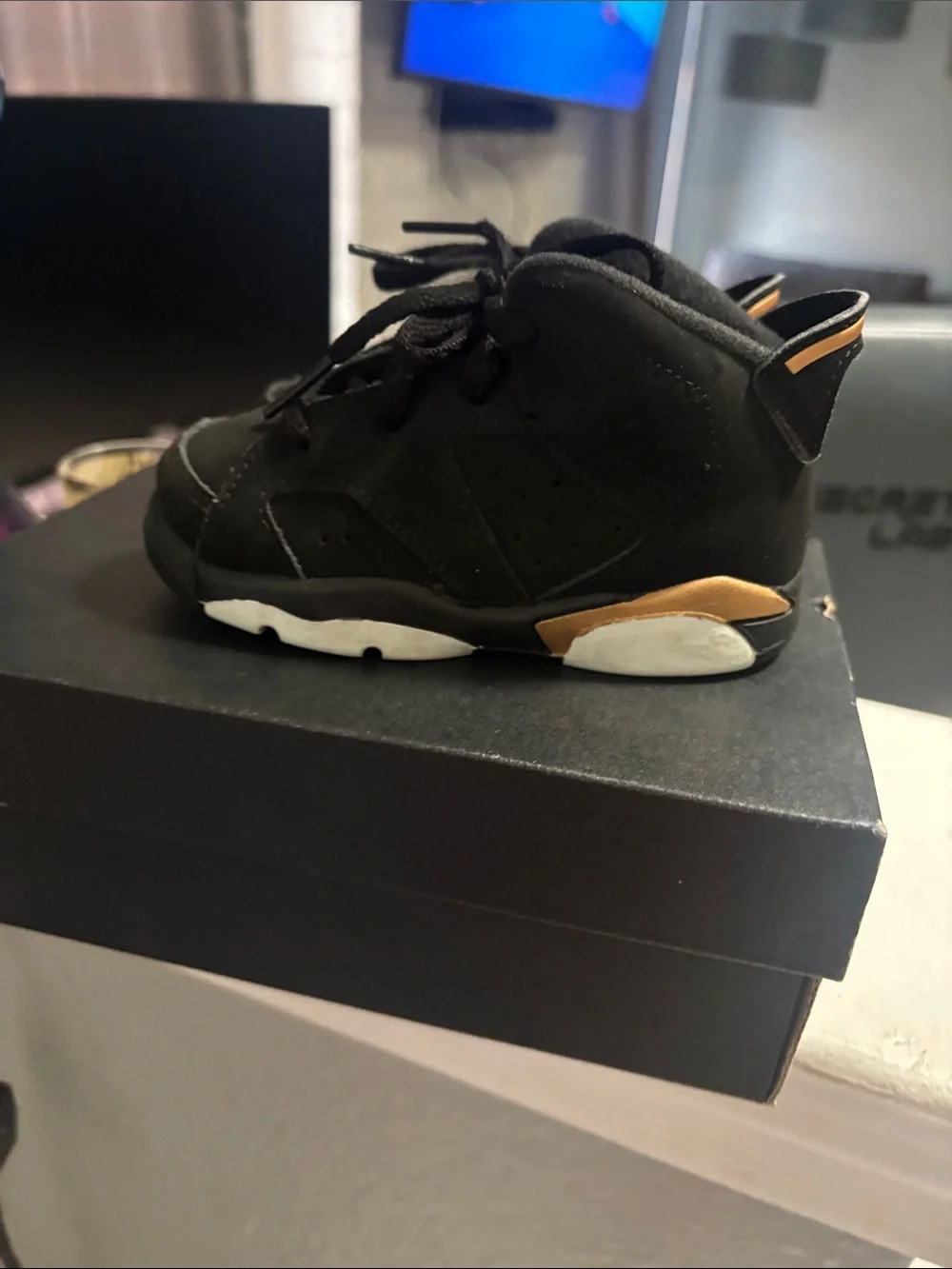 Jordan Kids Black and Gold High-Top Sneakers